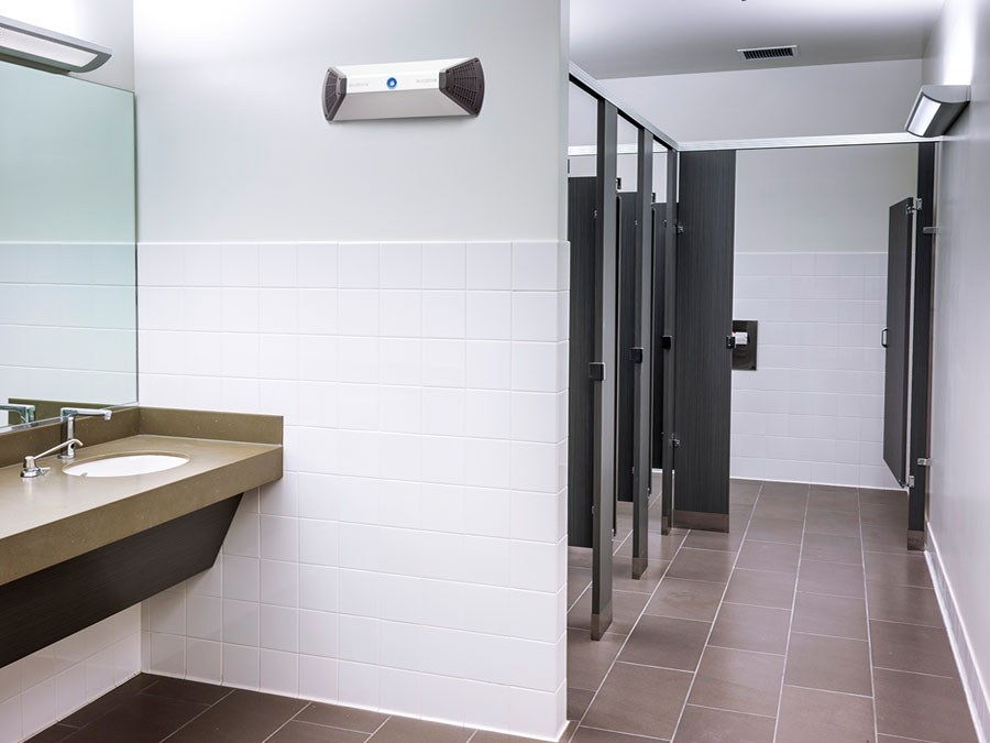 A Biozone air purification unit wall-mounted above the vanity in a hotel washroom