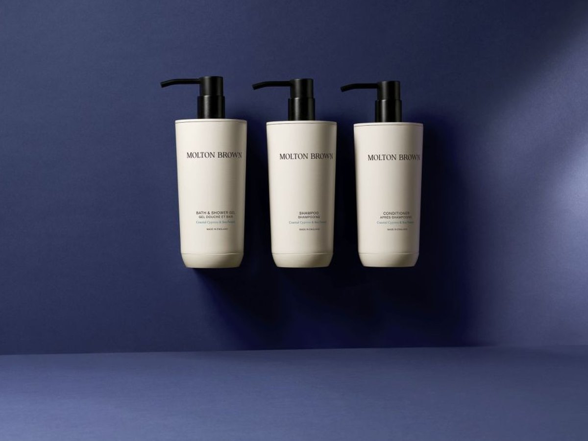 Molton Brown eco-system refillable bottles mounted flush to the wall