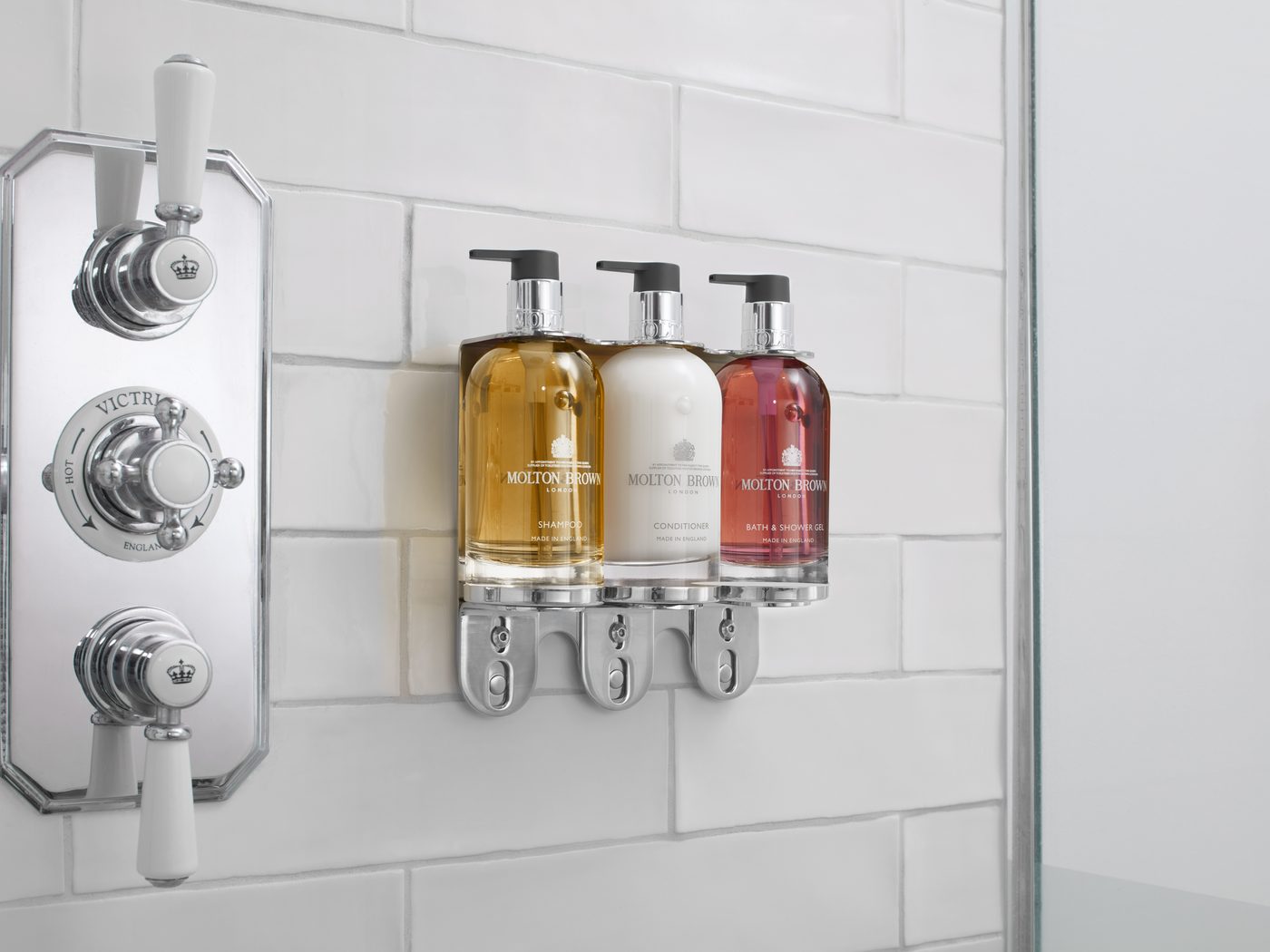 Molton Brown 300ml bottles on a chrome wall bracket
