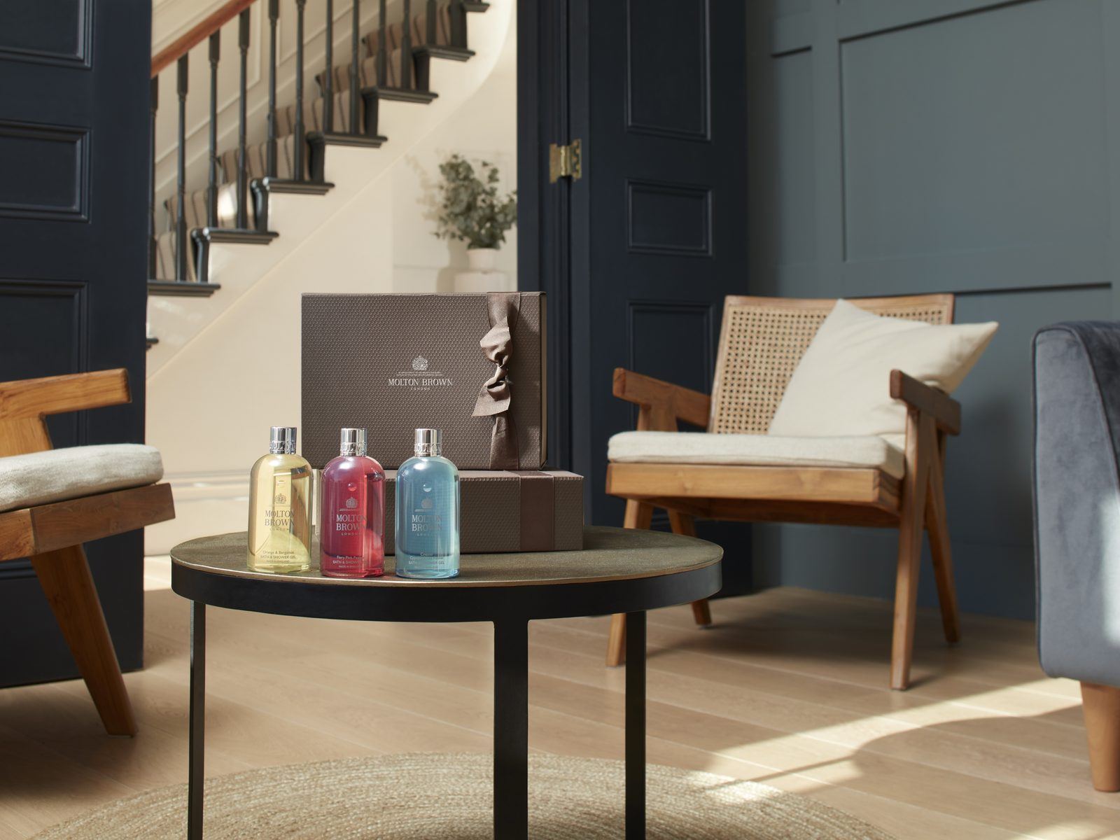 Molton Brown amenities displayed in a hotel lounge setting