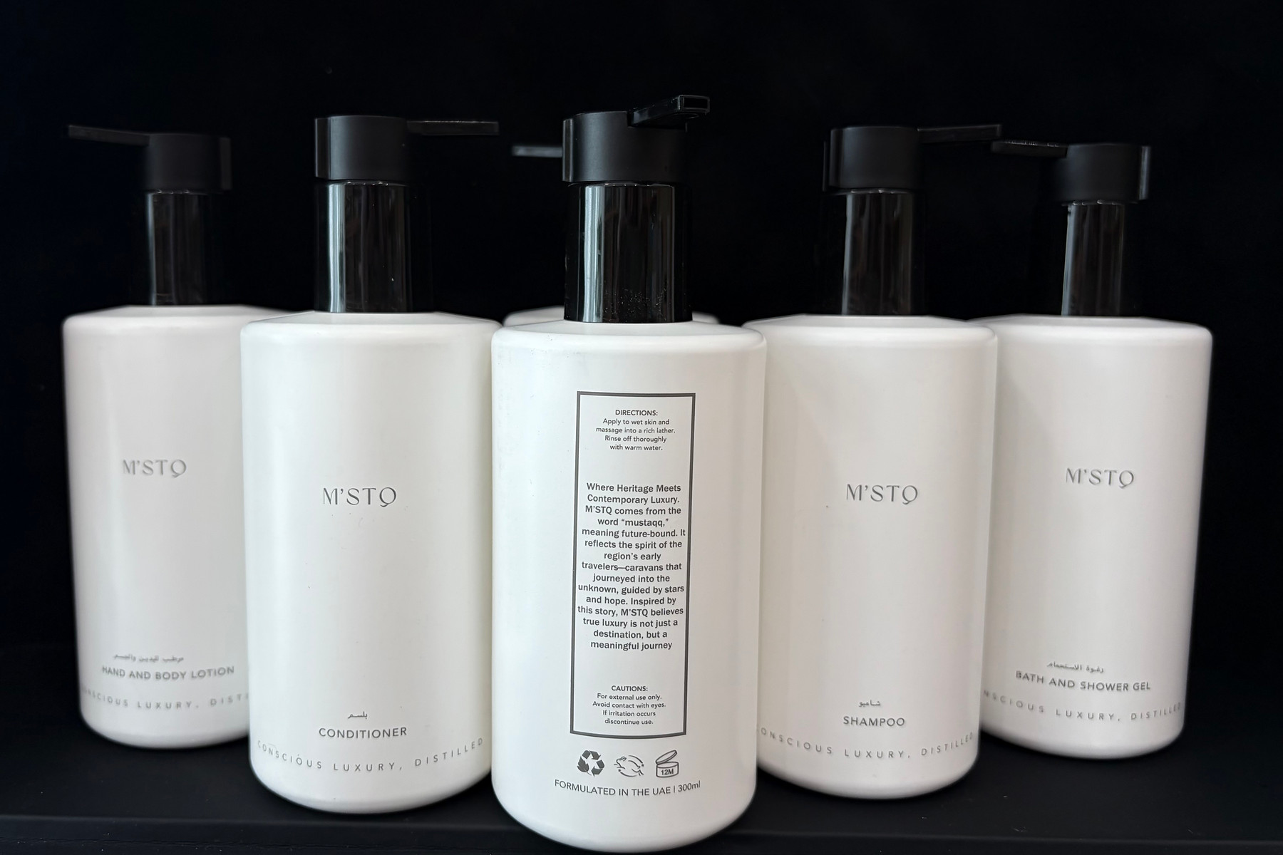 M’STQ 300ml hand and body lotion, conditioner, shampoo and bath and shower gel dispensers, each labelled in Arabic and English