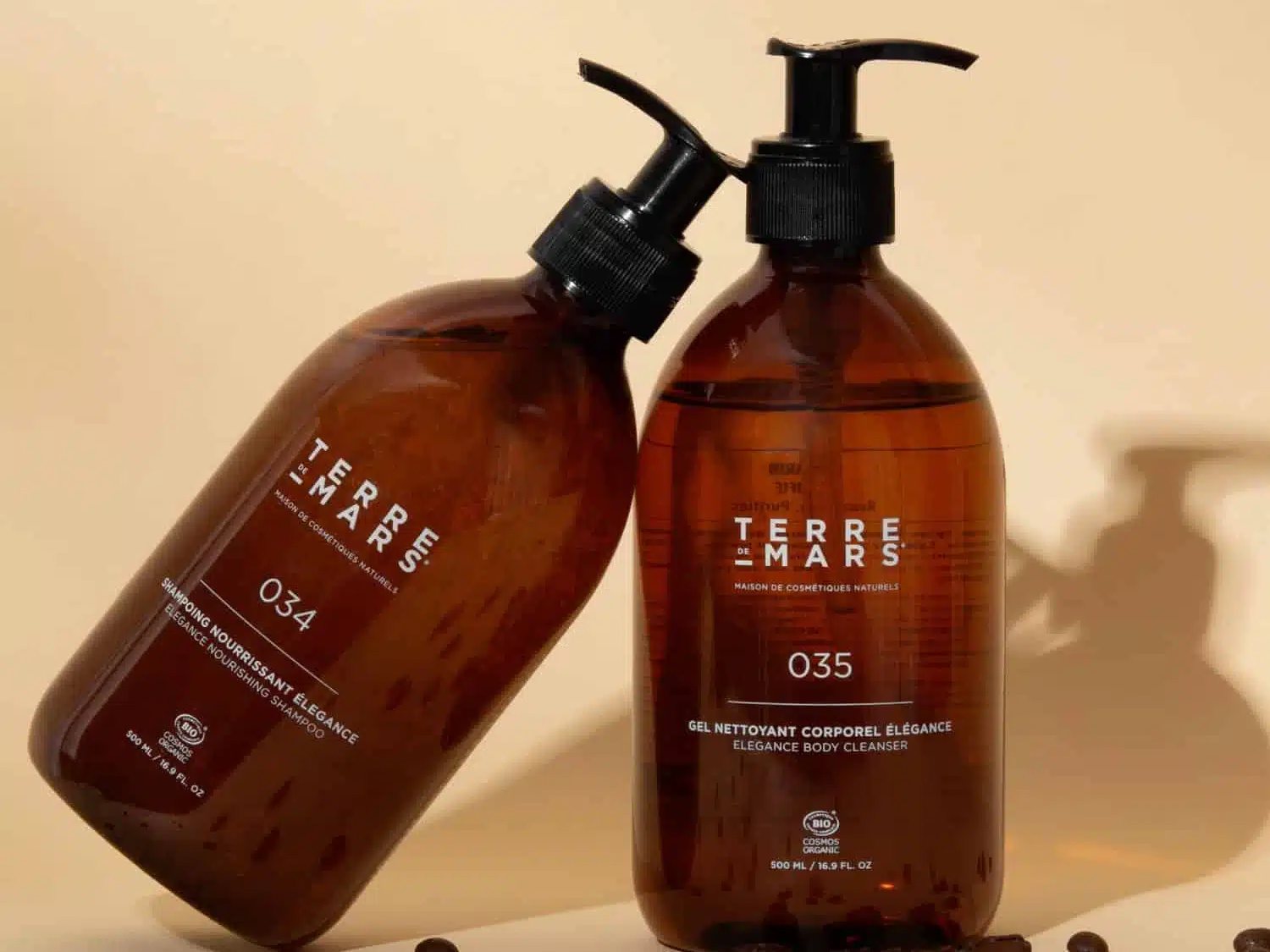 Terre de Mars 034 shampoo and 035 body cleanser with scattered coffee beans